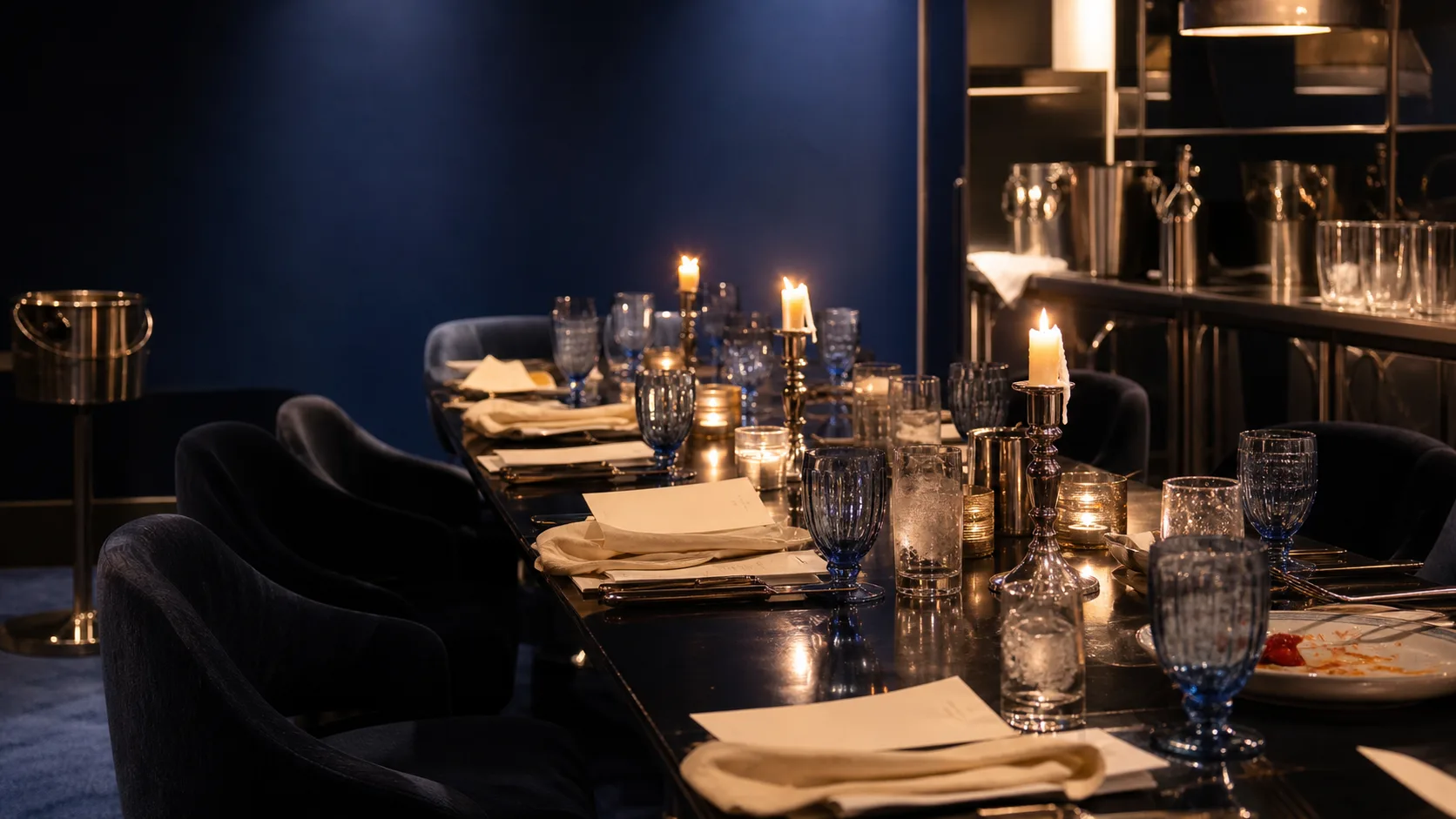 Long cobalt dining room with polished service
