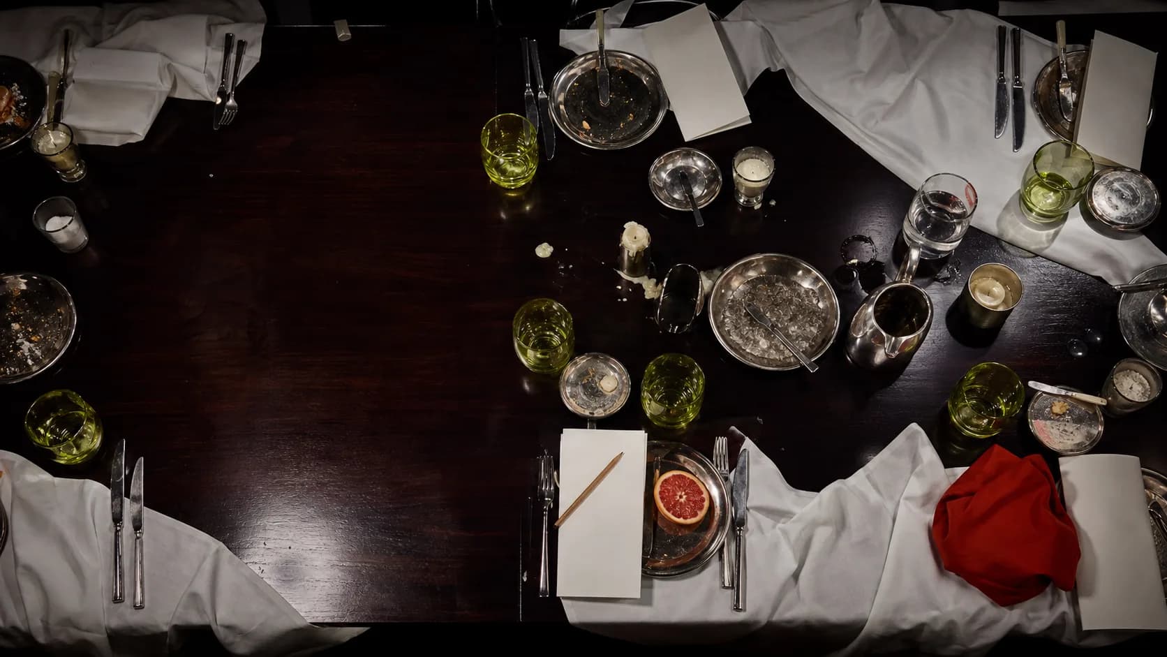 Long lacquer dining table after dinner